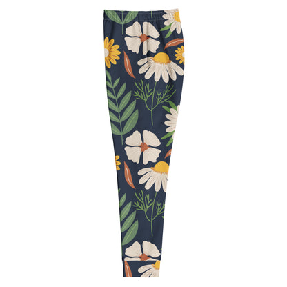 All over print spring garden joggers with a dark blue background filled with white and yellow flowers and green leaves